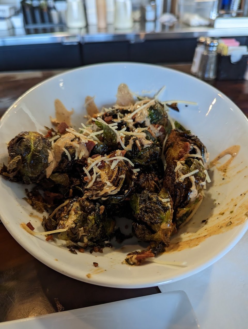 Restaurant menu listing comfort food and small plates.